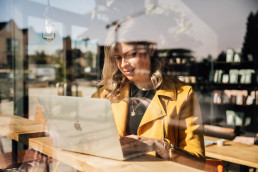 Sophie shot behind a window