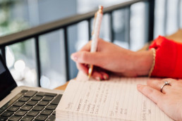 Sophie writing in notepad